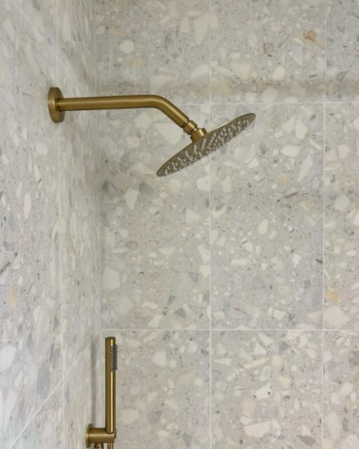 | Terrazzo Shower | 
with complimenting gold details and a custom kit-kat tile niche ✨

-
-
-
#terrazzo #showerdesign #tile #remodeling #remodel #showerremodel #boiseremodeling #boise #tiledesign #bathroomrenovation #luxurybathroom